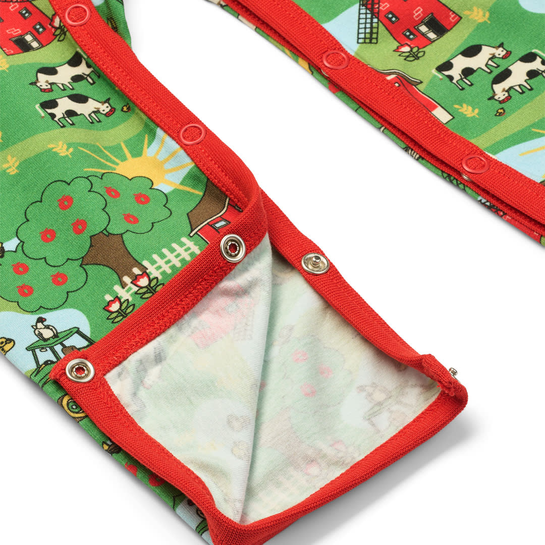 Elstar langærmet heldragt med bondegård